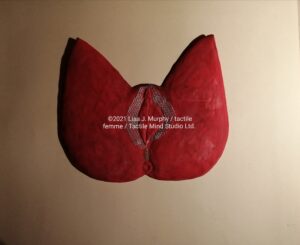 tactile femme by Lisa J. Murphy. Sculpture of a woman's inner thighs, vulva, and anus.