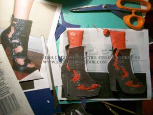 Tactile Atelier Bookmark by Lisa J. Murphy. Photo of clay sculptures of feet in high heels.